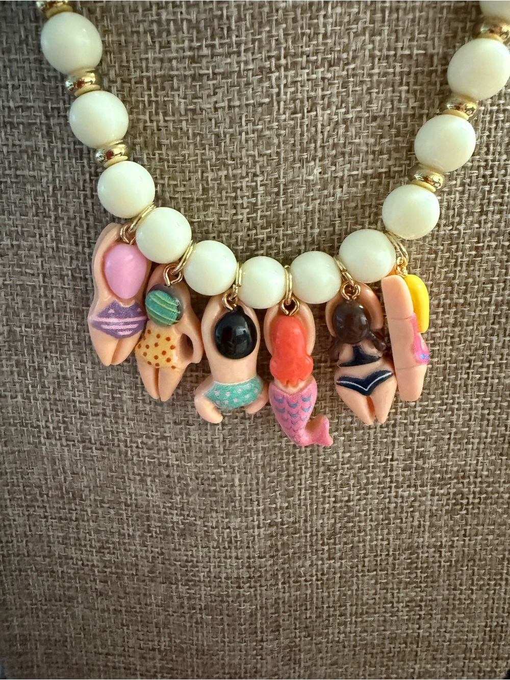 White Beaded Necklace with Gold Accents and Multicolor Swimmer Charms - Picture 7 of 10